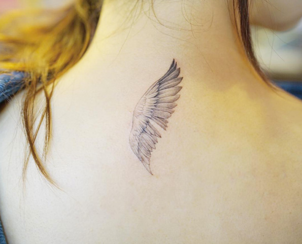 Single wing tattoo by Nando