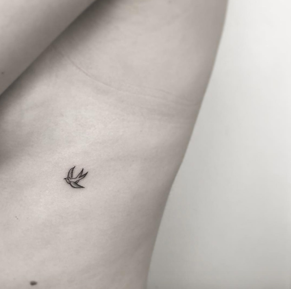 Beautiful little bird tattoo by OK