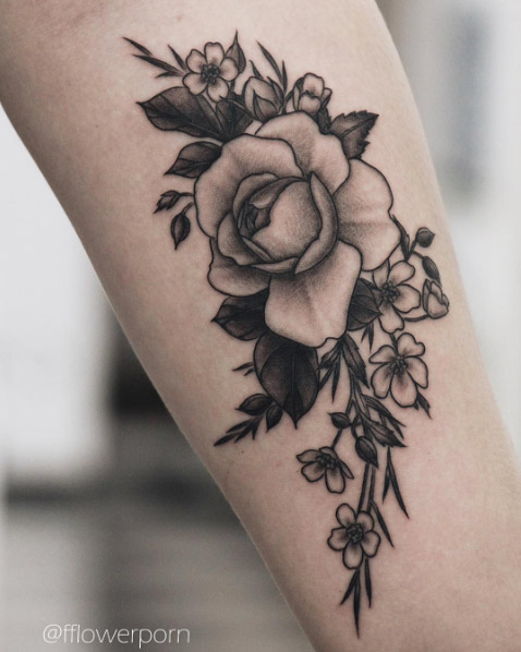 Black and grey ink rose tattoo by Olga Nekrasova