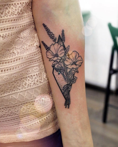 Vintage floral forearm tattoo by Anna Yershova