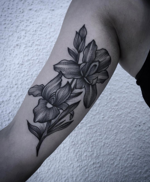 Dynamic blackwork iris flower tattoos by Laura Weller