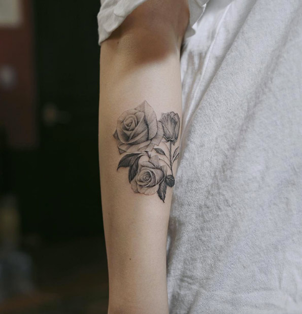 Blackwork roses on forearm by Anastasia Slutskaya