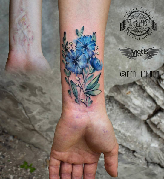 Blue watercolor flowers on wrist by Lenara