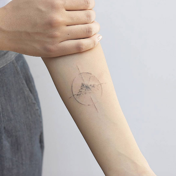 Sketch style single needle compass tattoo by Lindsay April