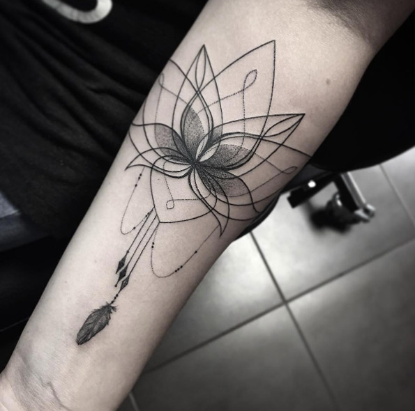 Beautiful lotus flower tattoo with hanging feather by Sara Reichardt