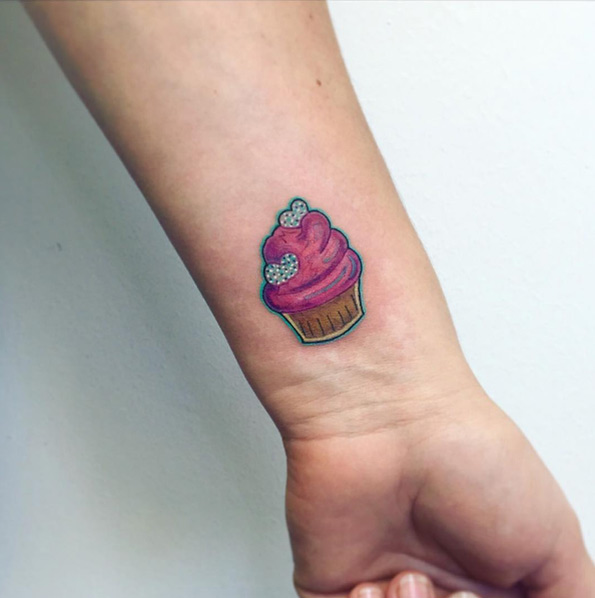 Cute cupcake tattoo by Sonia Tessari