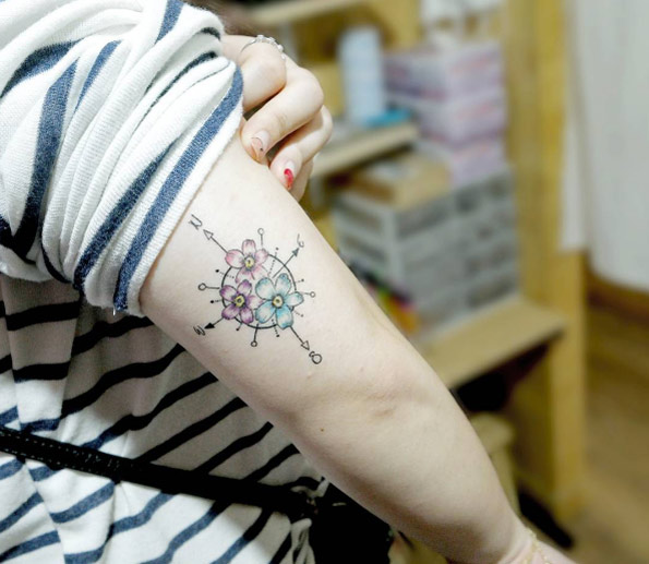 Cute flower compass tattoo by Chaewa