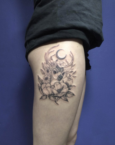 Elegant floral stag tattoo on thigh by Jayko