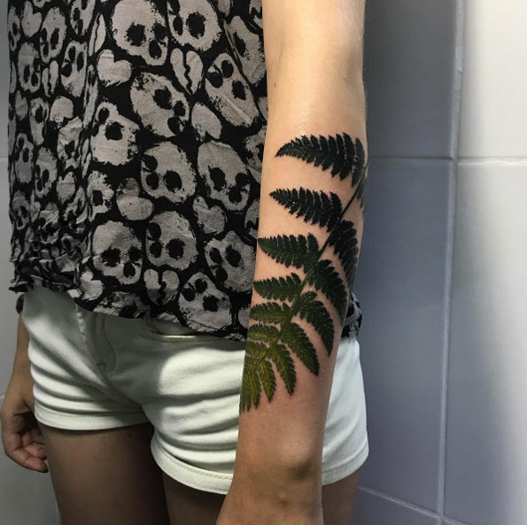 Gradient fern frond tattoo by Anastasia Slutskaya