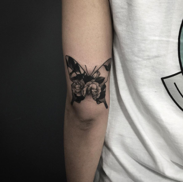 Double exposure floral butterfly tattoo by Pari Corbitt