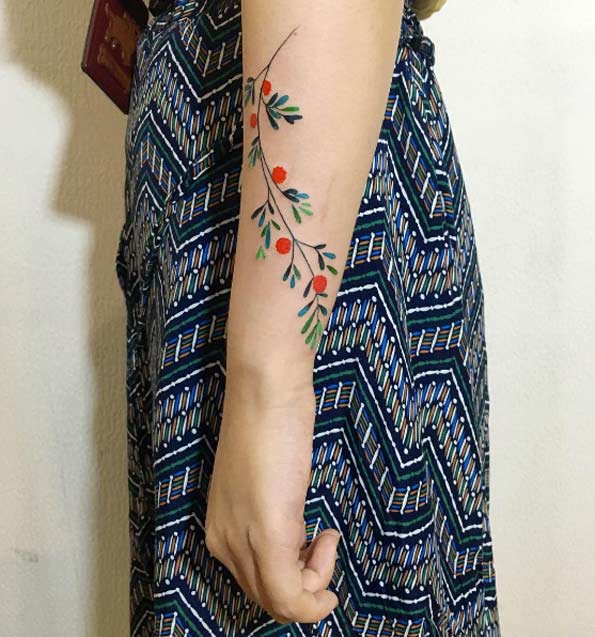 Floral forearm tattoo by Zihee