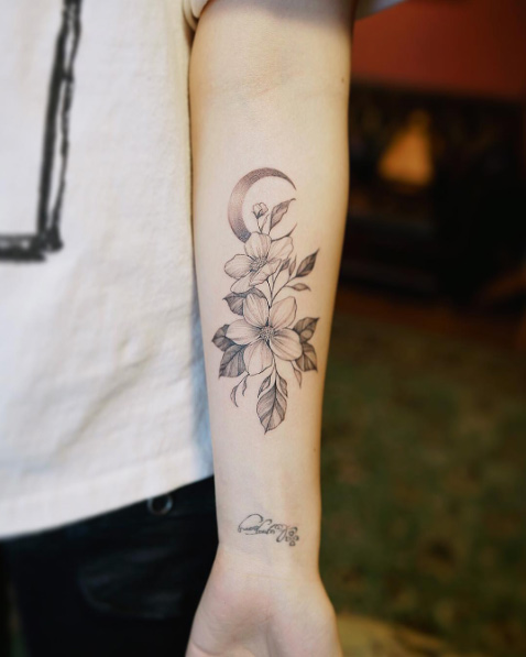 Flowers and crescent moon tattoo by Nando