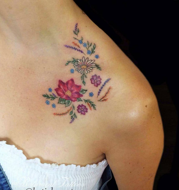 Tiny florals on collarbone by Katie Bee