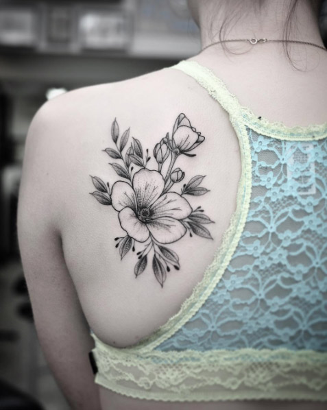 Blackwork florals on back shoulder by Chris Jones