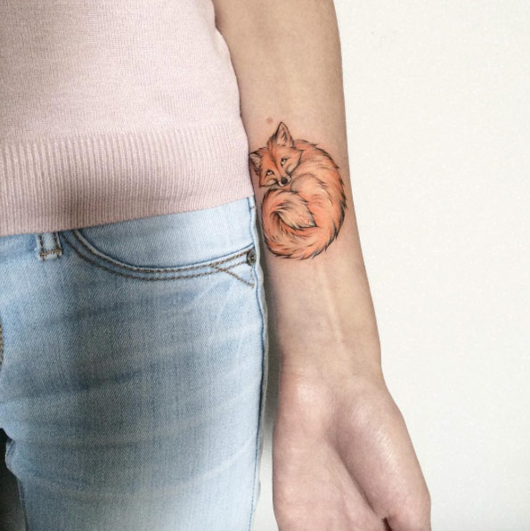 Fox tattoo on wrist by Olga Koroleva