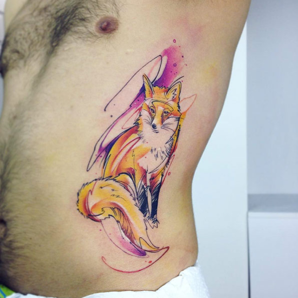 Gorgeous watercolor fox tattoo on rib cage by Adrian Bascur