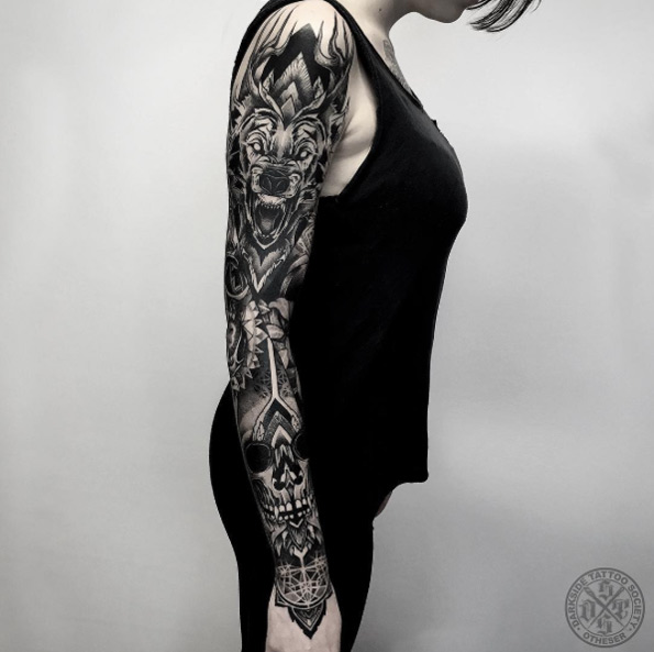 Heavy blackwork sleeve by Darkside Tattoo