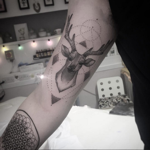 Beautiful geometric stag tattoo by Chelsie Harrison