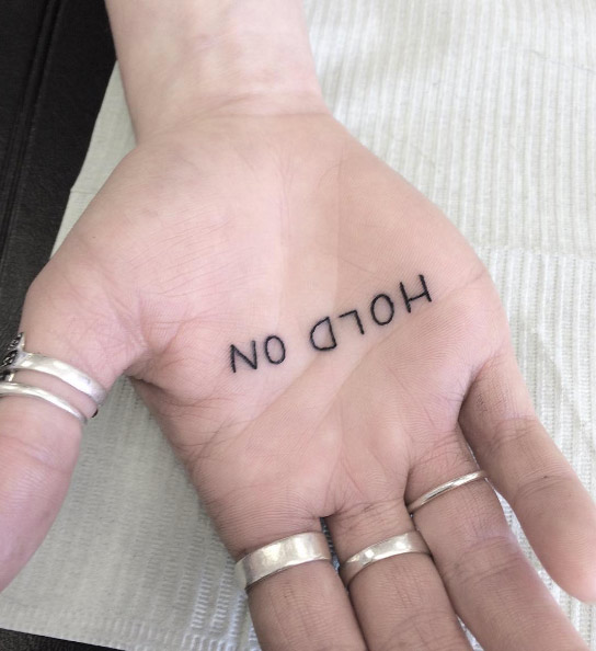 'Hold on' palm of hand tattoo by Rachelle Gammon