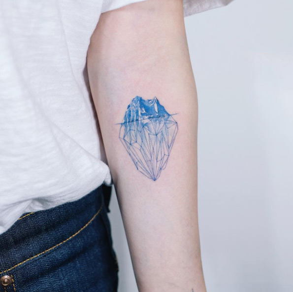 Geometric iceberg tattoo by Sol Art