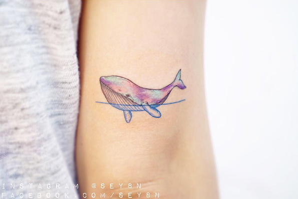 Iridescent whale tattoo by Seyoon Gim