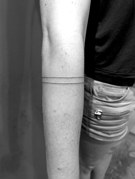 Two line armband tattoo by Daniel Winter 