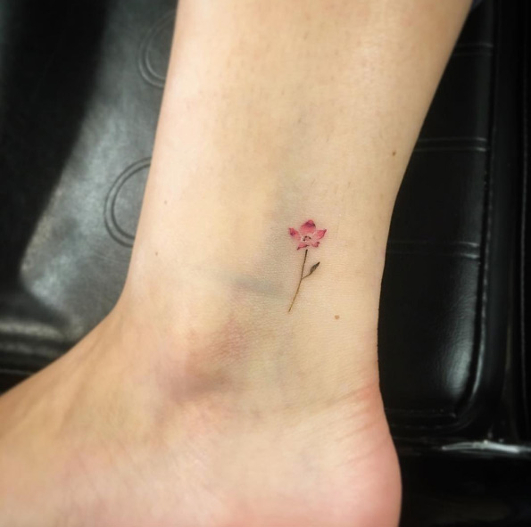 Micro flower tattoo on ankle by OK