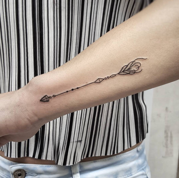 Ornamental arrow tattoo by Isabel Barcelona