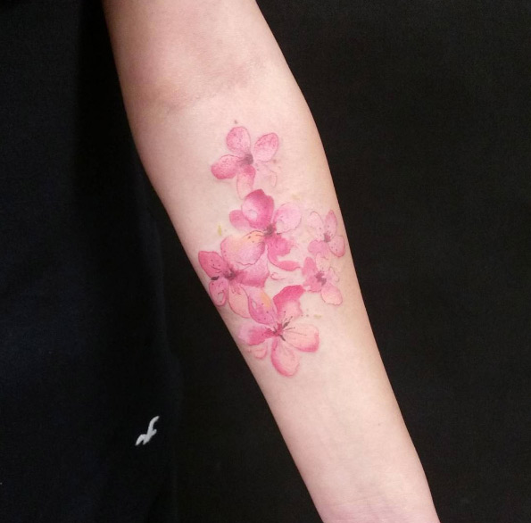 Painted cherry blossom tattoo by Marta Szumigaj