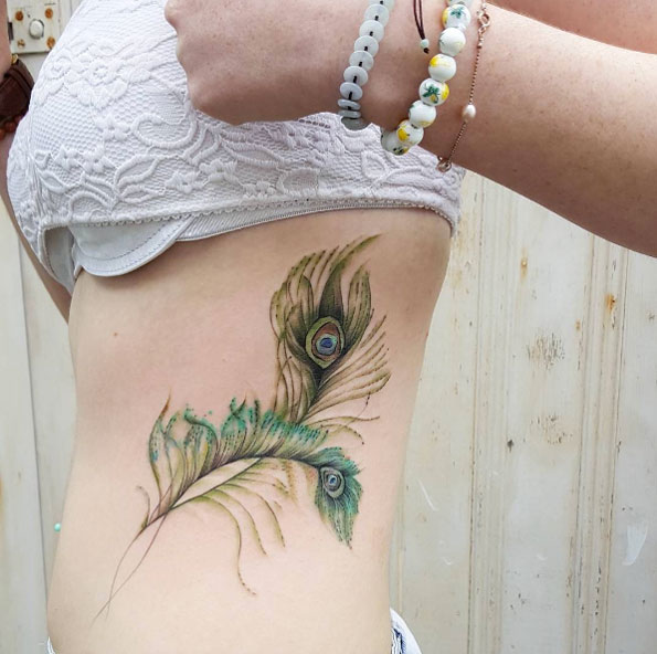 Peacock feather tattoos by Jemka