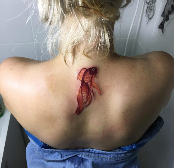 Perfect koi fish tattoo by Anastasia Slutskaya