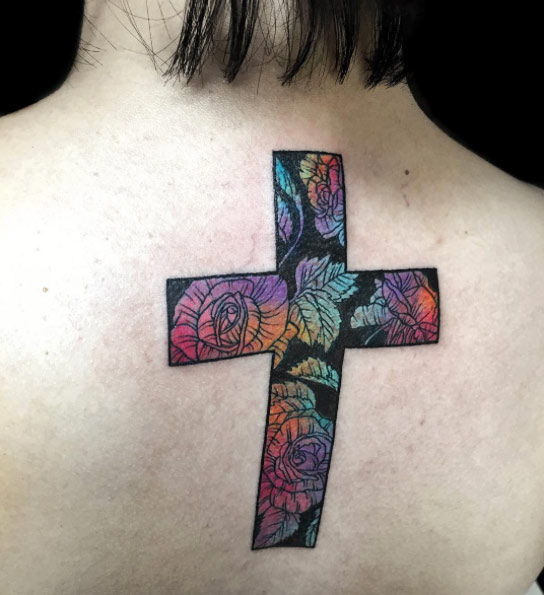 Gradient rose-filled cross tattoo by Nadya Natassya