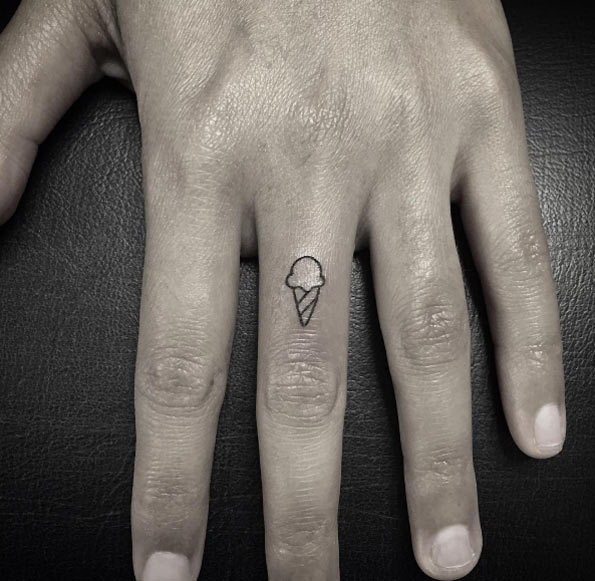 Small ice cream cone tattoo on finger by Lindsay April