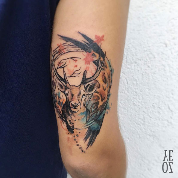 Abstract stag tattoo on tricep by Yeliz Ozcan
