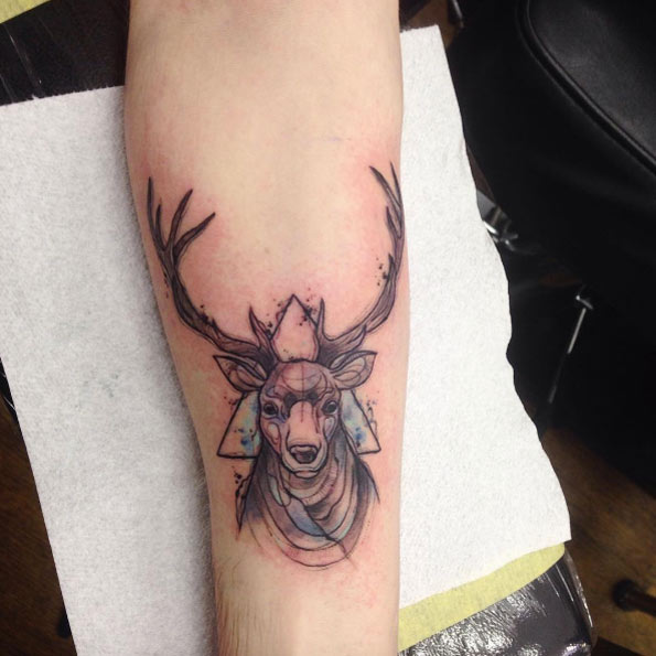 Subtle watercolor stag tattoo by Cynthia Sobraty