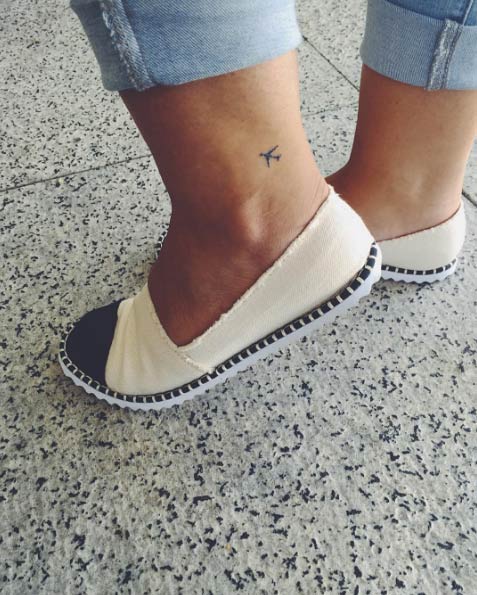 Tiny plane tattoo on ankle via Gula de Viagem