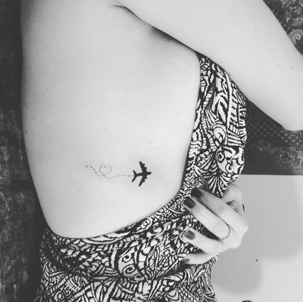 Adorable travel-themed rib cage tattoo by Aline