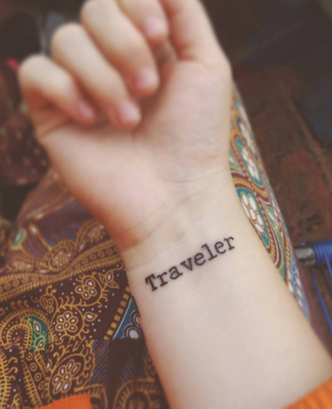 'Traveler' tattoo on wrist via Clara Held
