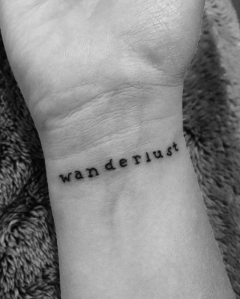 'Wanderlust' wrist tattoo via Xena Jones