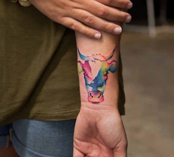 Watercolor cow tattoo by Georgia Grey
