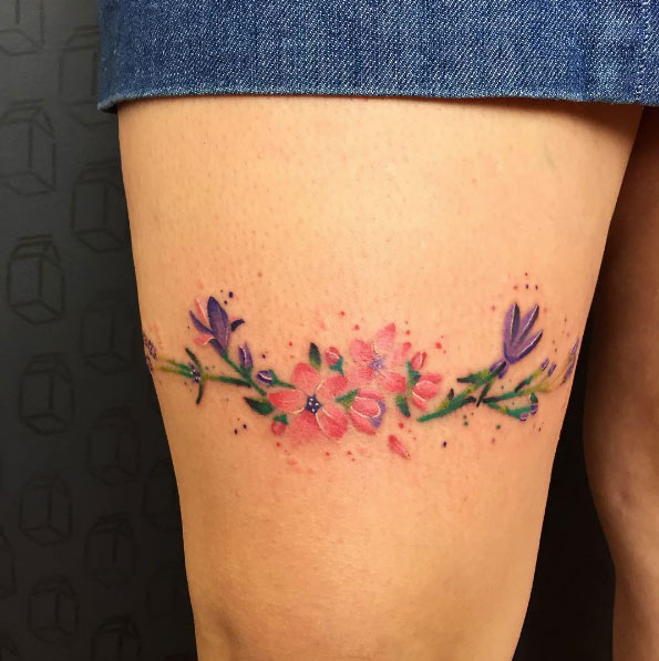 Girly watercolor florals on thigh by Emmanuel