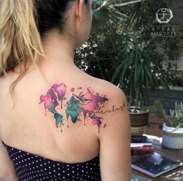 Watercolor map tattoo on back shoulder by Koray Karagozler