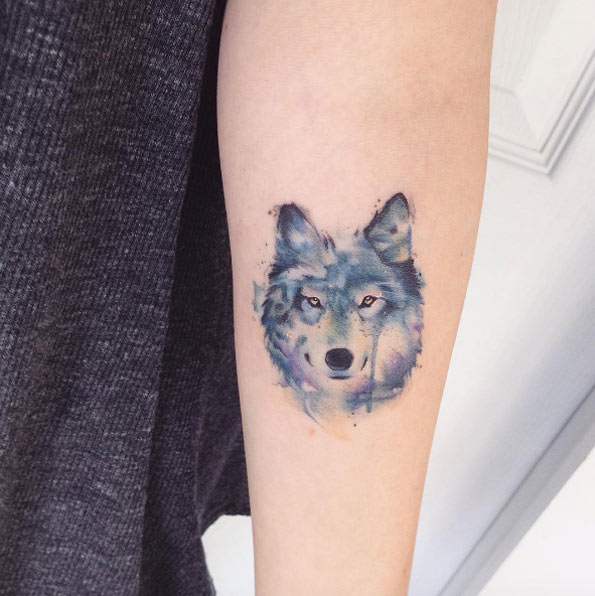 Watercolor wolf tattoo by Adrian Bascur