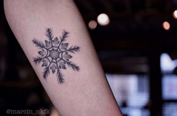 Feathered snowflake tattoo by Marcin Nkfk