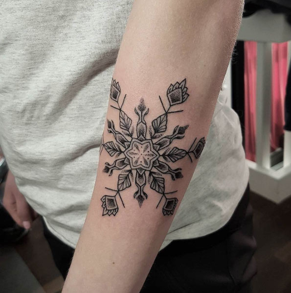 Decorative dotwork snowflake tattoo by Viktor Westberg