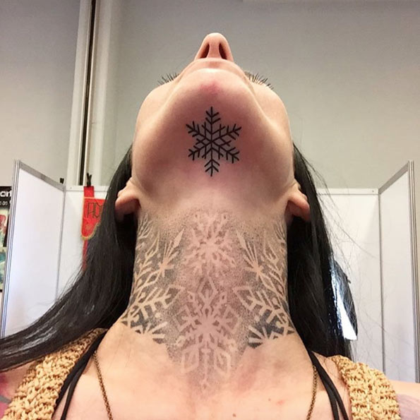 Chin and neck snowflake tattoos via Madame Tutli Putli