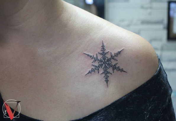 Ornate snowflake tattoo by Sadık Can Turksall