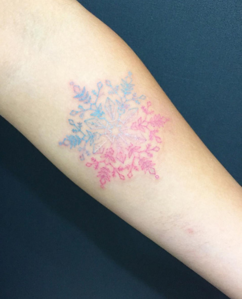 Pink and blue snowflake tattoo by Eden