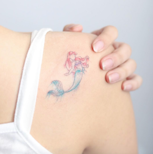 Delicate little mermaid tattoo by Hello Tattoo