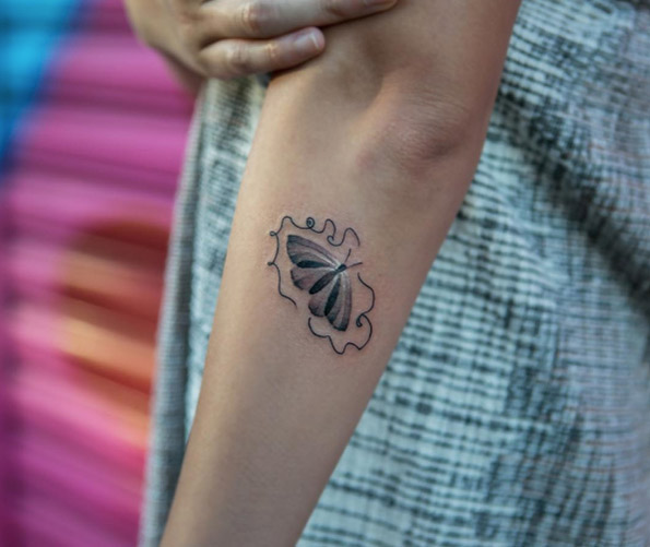 Beautiful butterfly tattoo by Georgia Grey